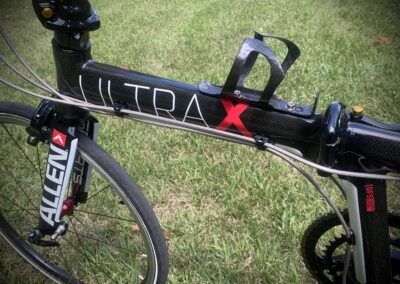 A bike with the words ultra x on the handlebars.