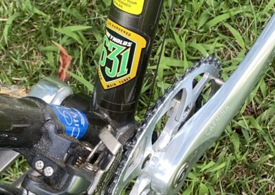 A close up of a bicycle with a chain on it.