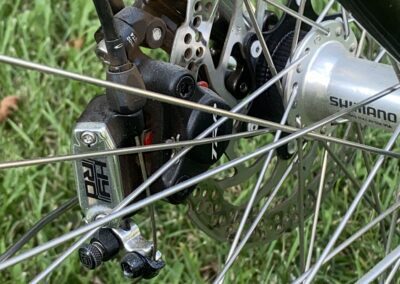 A close up of a bicycle wheel with a disc brake.